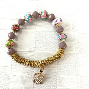 Bracelet rhinestone turtle multi color beads. Fits wrist up to 8 inches. NWT